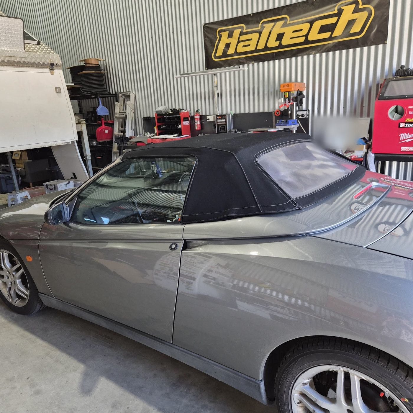 A 1998 Alfa Romeo Spider inside the CRM workshop, in for dash light and climate control faults